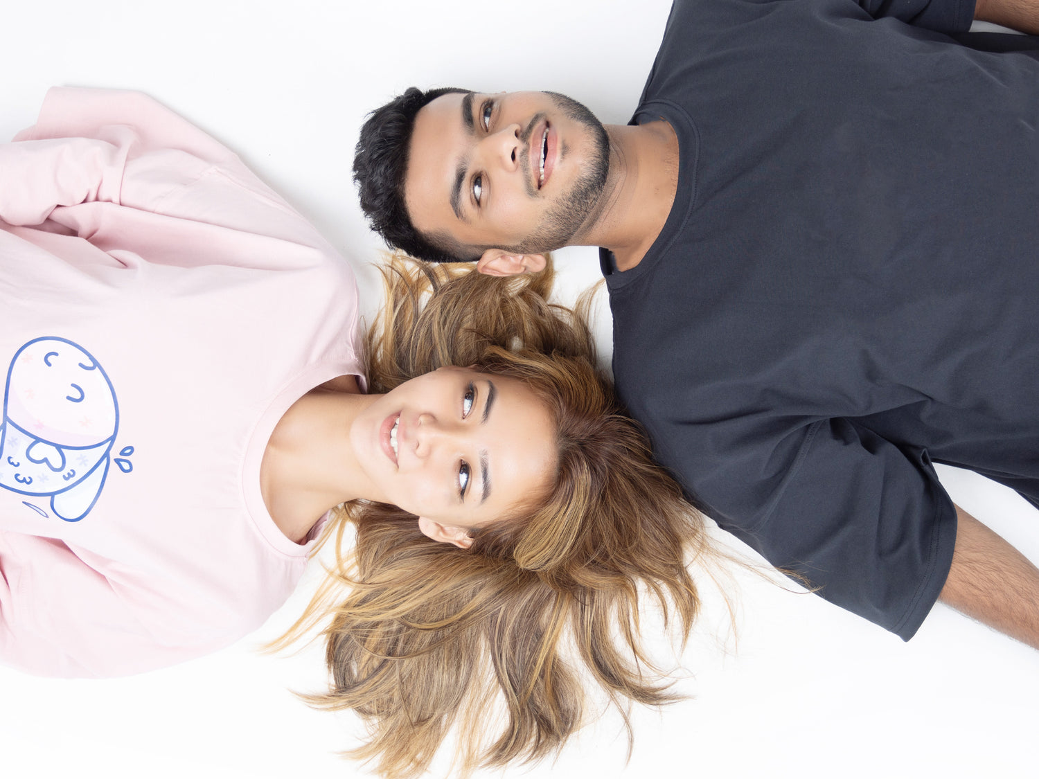 Male and female model wearing Relax Tees